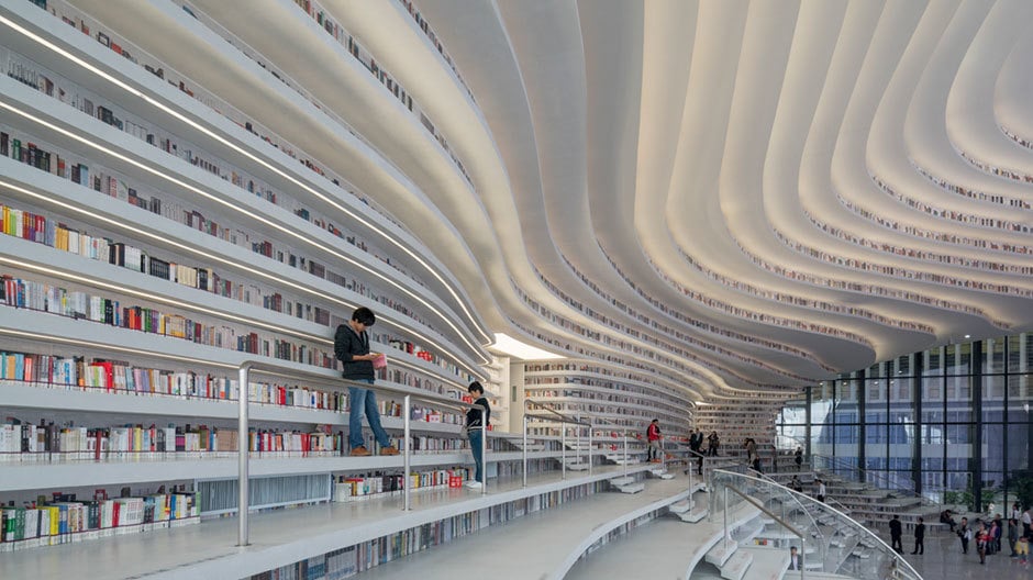 In der vom niederländischen Büro MVRDV geplanten <i>Tianjin Binhai Library</i> formen über 1,2 Millionen Bücher einen wolkenartigen Raum. In der vom niederländischen Büro MVRDV geplanten Tianjin Binhai Library formen über 1,2 Millionen Bücher einen wolkenartigen Raum.